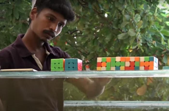 На одном дыхании: мужчина собрал 6 кубиков Рубика, находясь при этом под водой (видео)