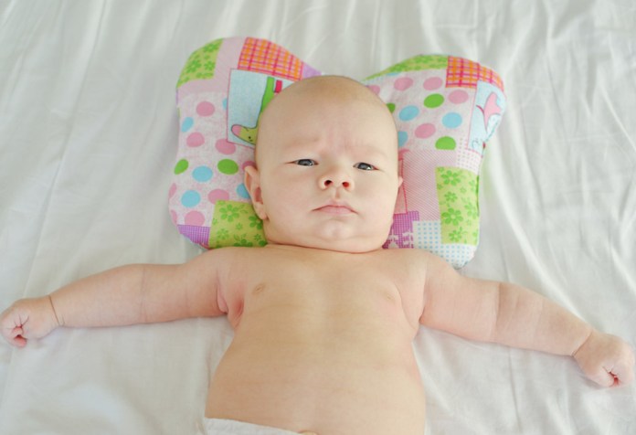 Подушка для исправления кривошеи у новорожденных