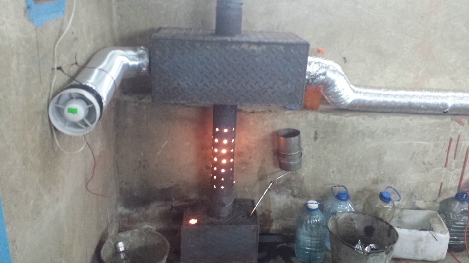 Установленная печка на отработке в гараже
