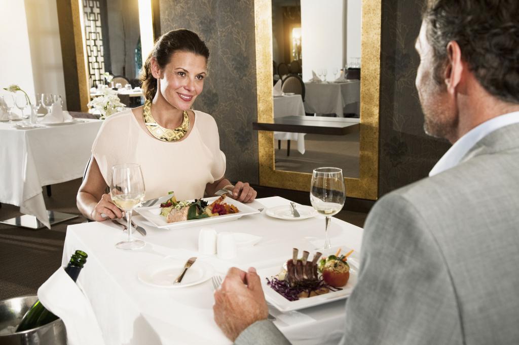 Woman in a Restaurant in a expensive Dress.