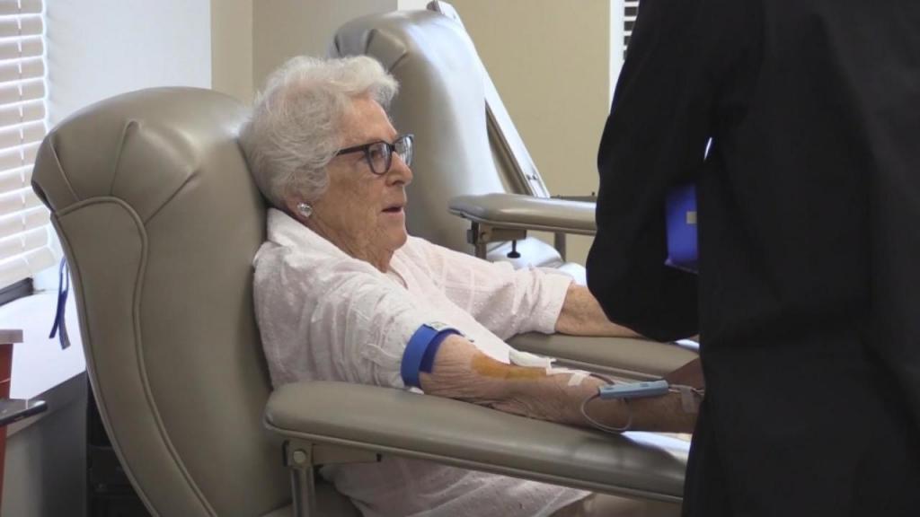 Elderly woman donates blood