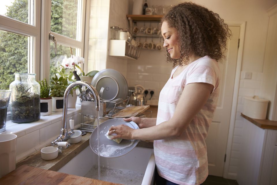 Woman washing dishes