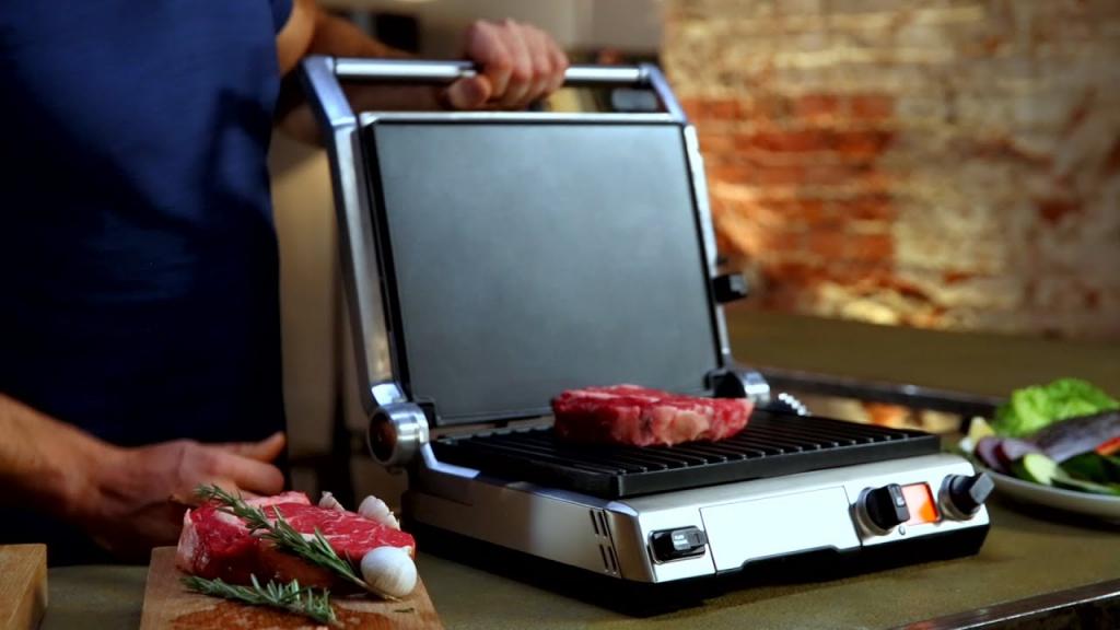 Man cooks on electric grill