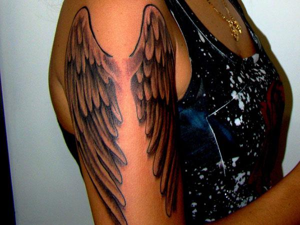 Tattoo wing on the arm