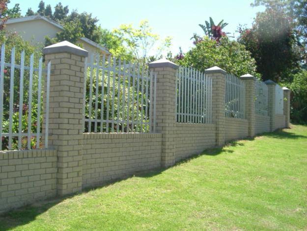 photo of fences with brick pillars