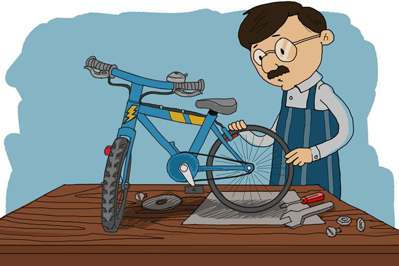 Он чинит велосипед