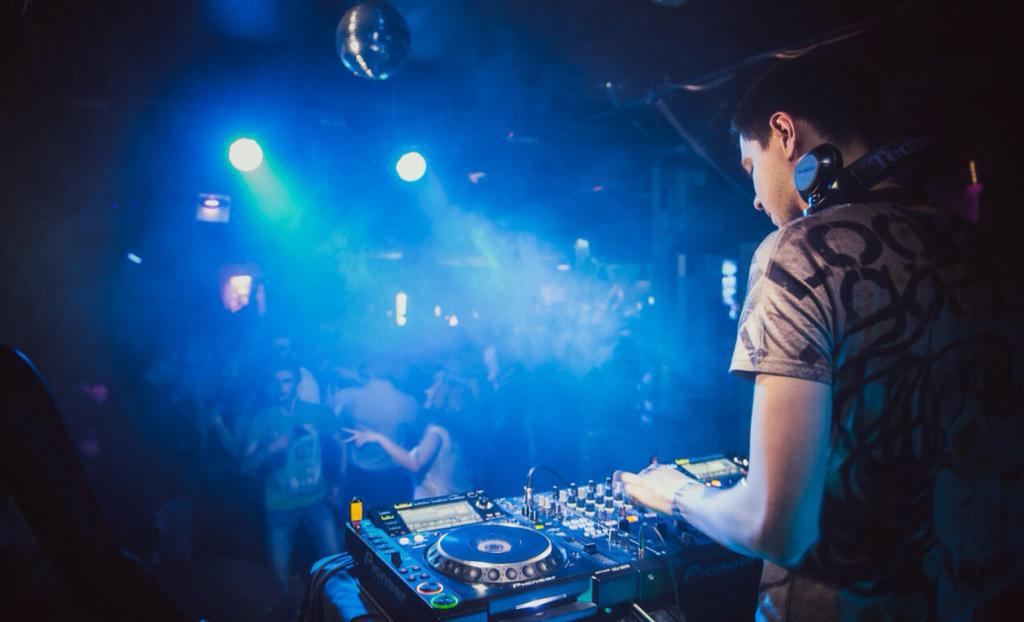 DJ at the console during a disco in the marshmallow club