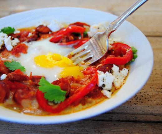 fried eggs with tomatoes and sausage