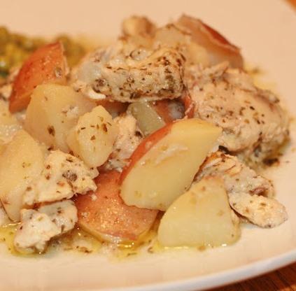 potato with chicken in the oven in a pot