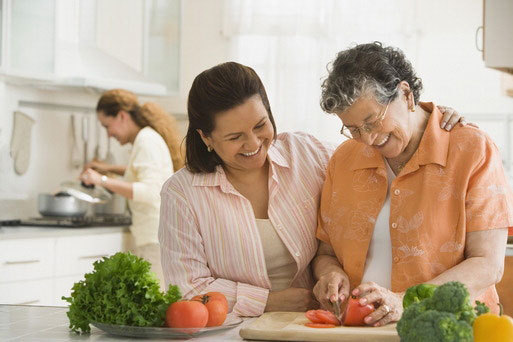 Woman cuts vegetables