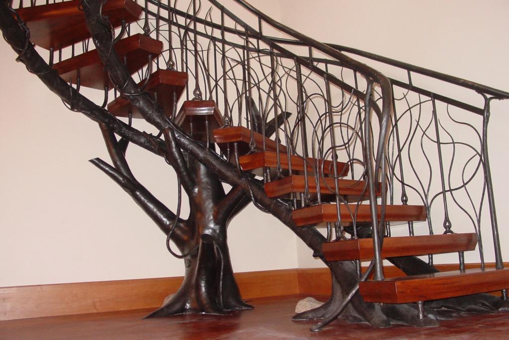 Staircase with forged railing