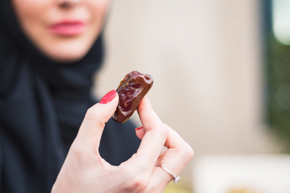 woman eating dried dates