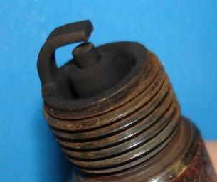 black soot on spark plugs