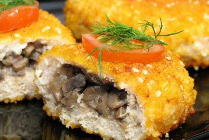 meatballs with mushrooms and cheese in a pan