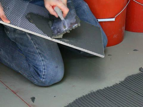 laying tiles on the porch