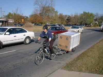 carry the refrigerator while lying