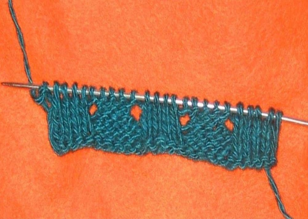 Wrong row of knitted lace gum