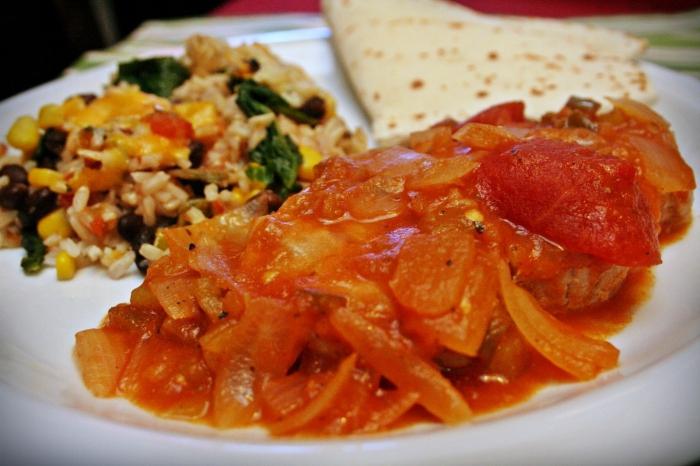 Sliced ​​tomatoes with onions for the winter