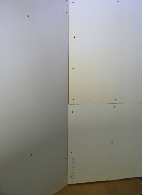 installation of drywall on a wall with a profile