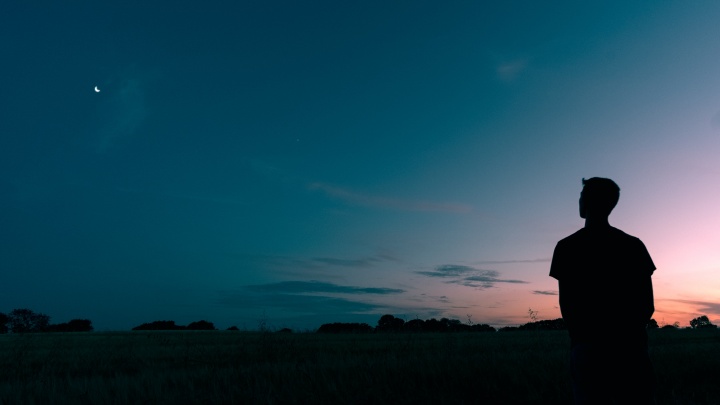 man is looking at the sky