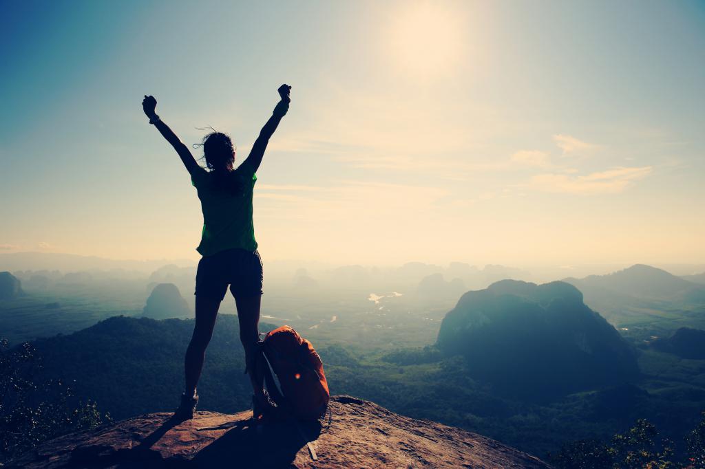 Girl on top of the mountain