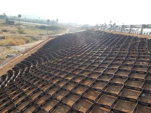 Reinforcing slopes with a geogrid