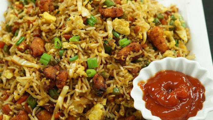 fried chicken with rice in a pan