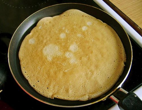 Thin pancakes baking