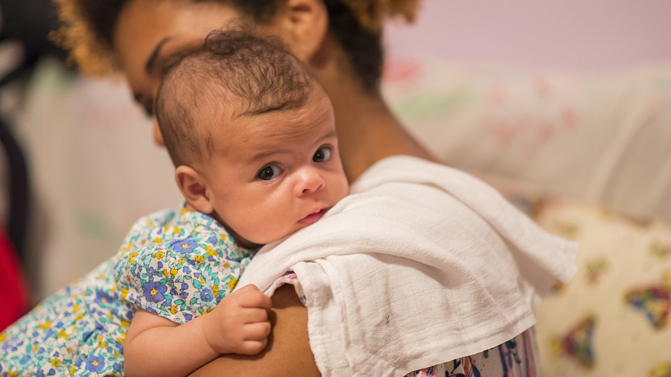 Why a newborn baby spits up after feeding