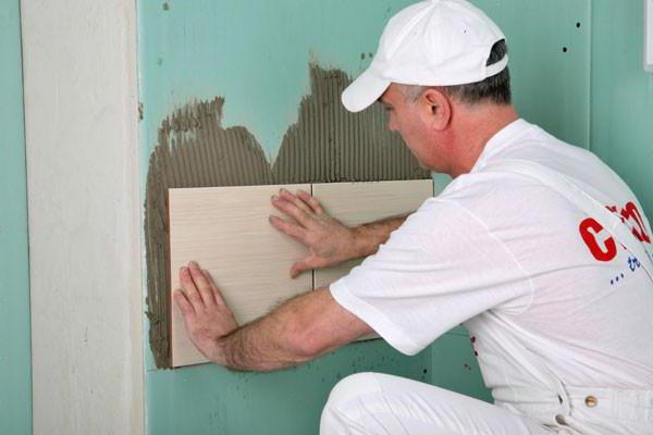 laying tiles in the bathroom on drywall