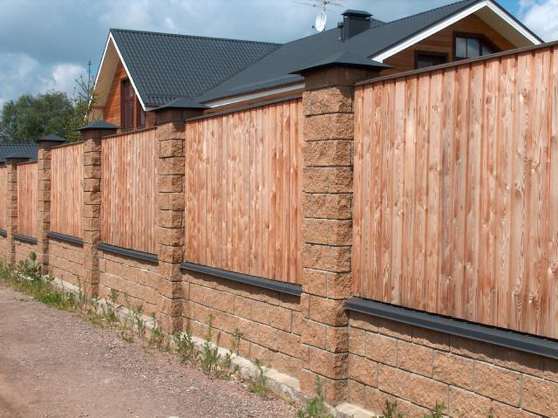 photo of a fence from a sheeting under a tree