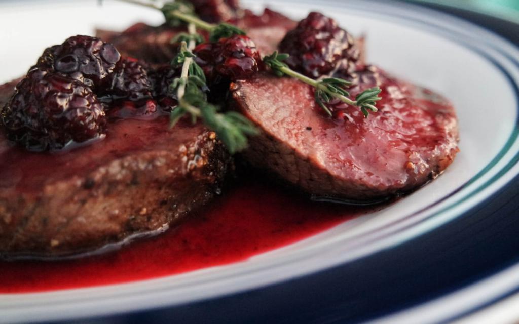 Beef steak in berry sauce