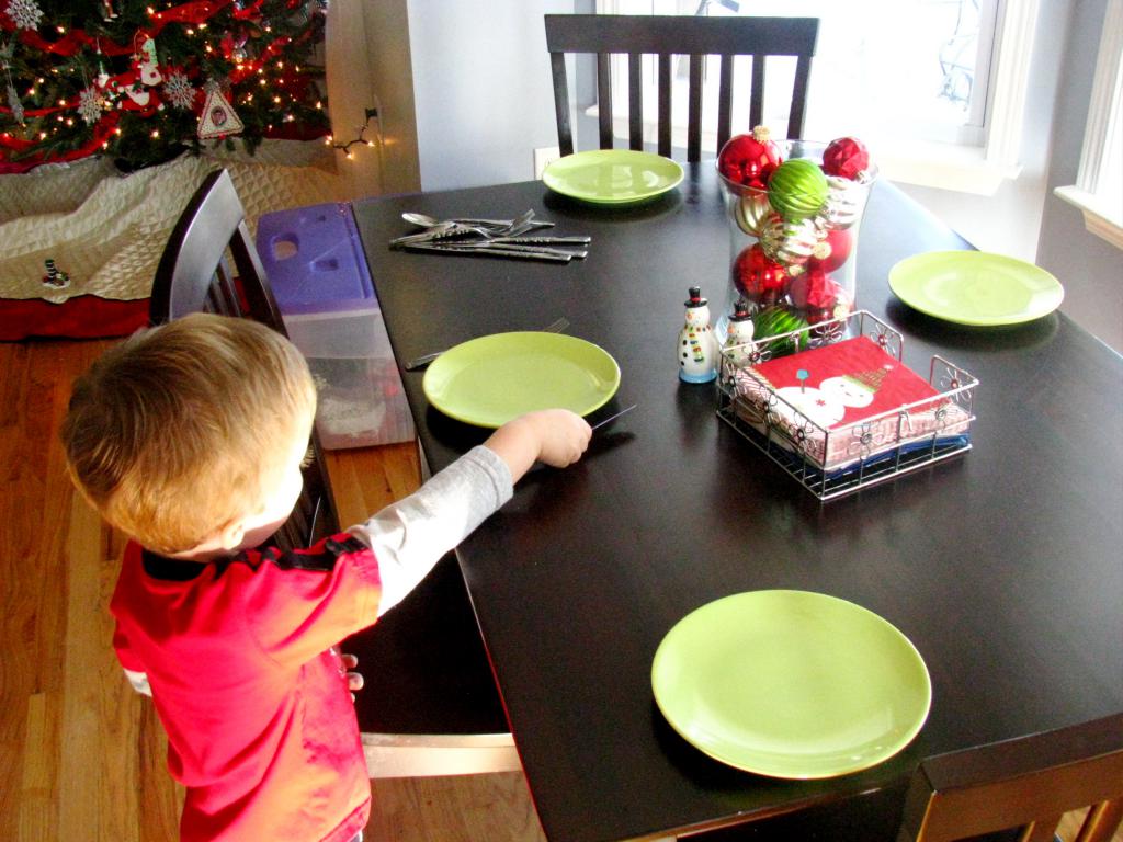 the child sets the table