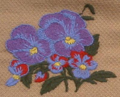 Embroidery with woolen threads flowers