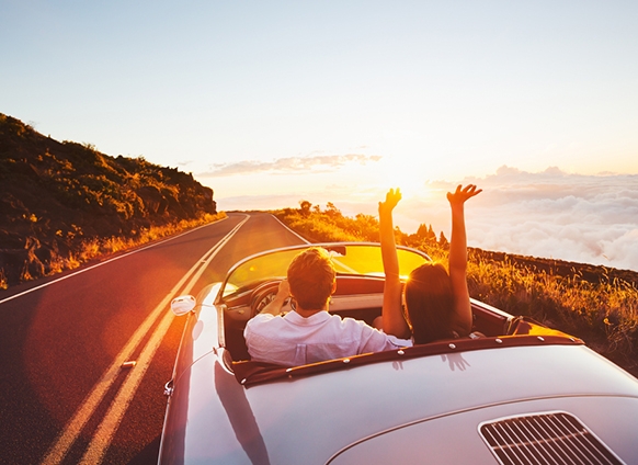 Couple rides in a convertible