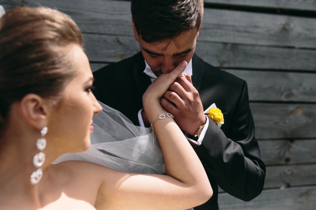 Kissing bride hands