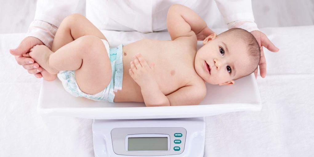 weighing a child in a hospital