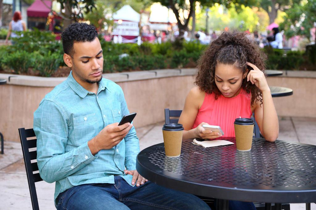 The guy and the girl are on the phones