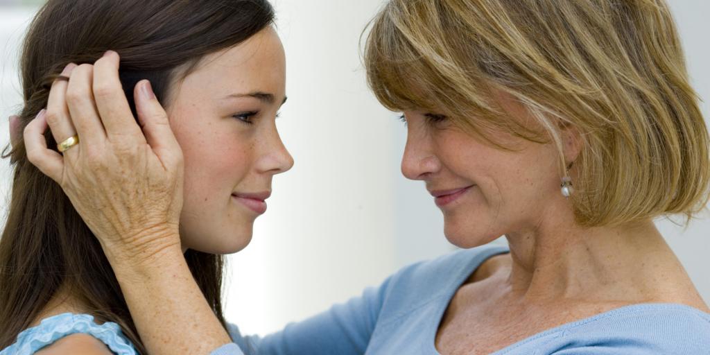 Mom and her daughter are standing