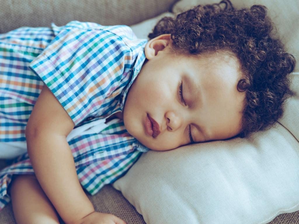 At what age does the child stop sleeping during the day