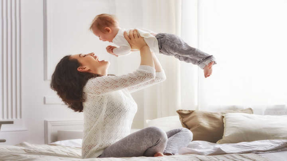 sleeping together with a newborn pose