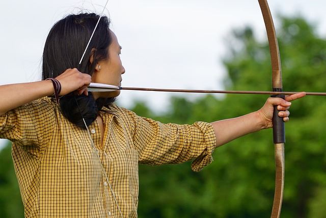 Girl shoots with homemade bow