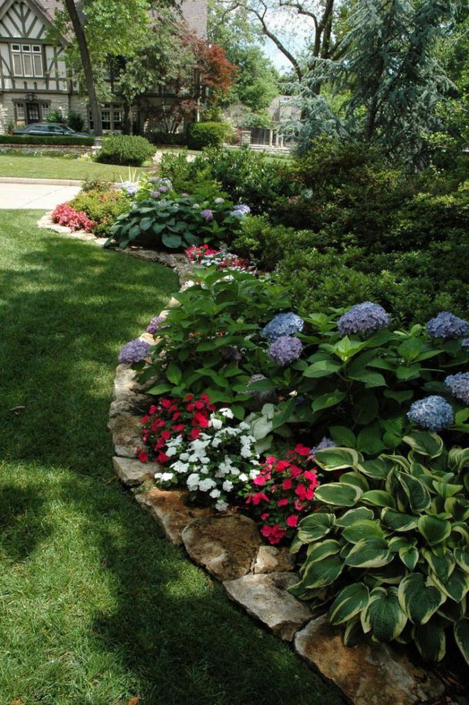 flowerbed with blue, red and white flowers