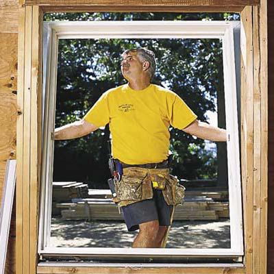 plastic windows in a log house