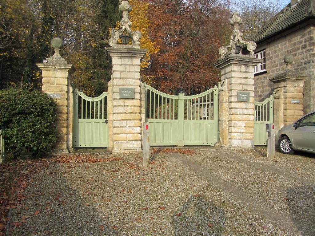 Mechanisms for swing automatic gates