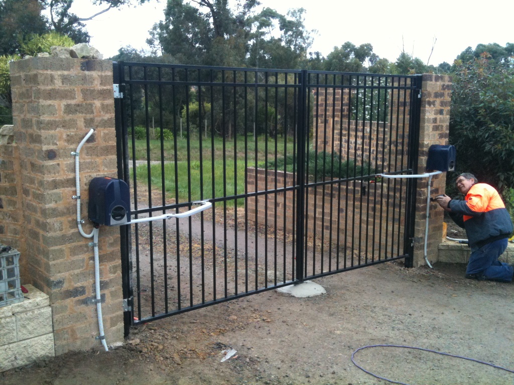 What is the mechanism for opening a swing gate