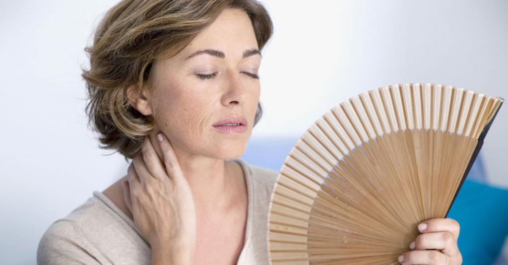 aching pain in the lower abdomen with menopause