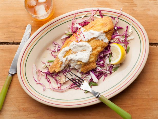 catfish fried with sauce and vegetables