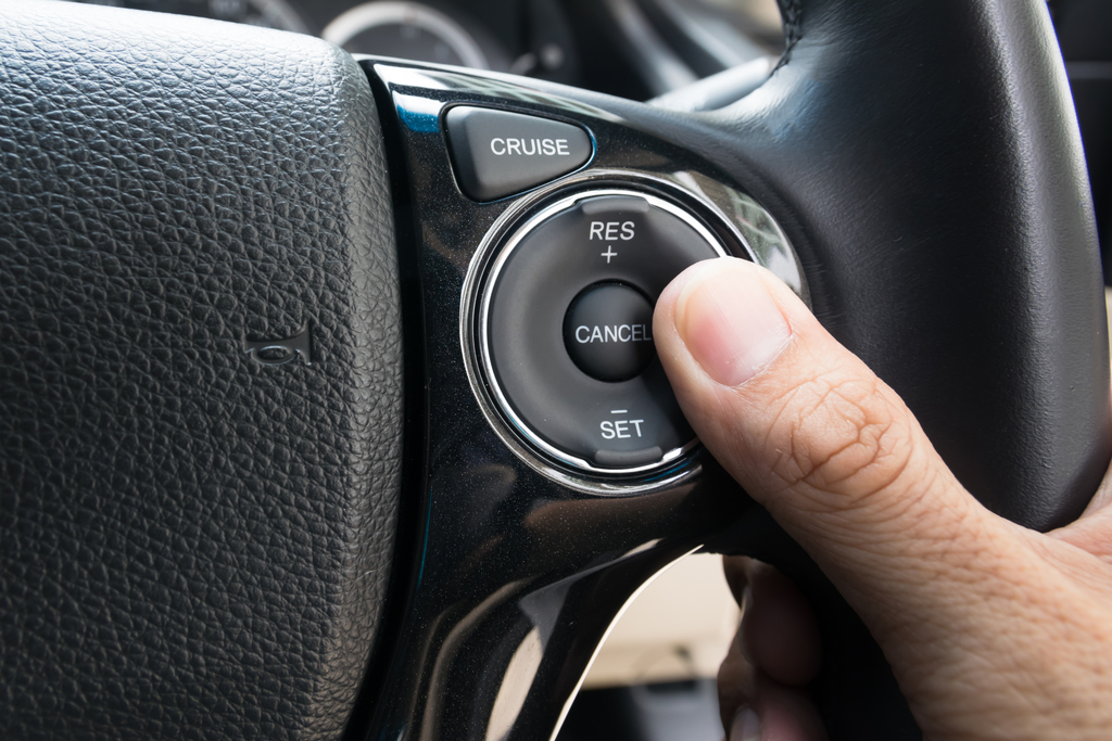 Pressing a cruise control button