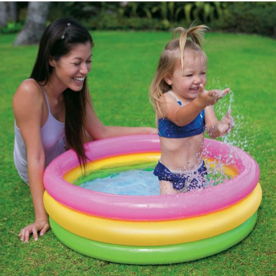 girl splashing in the pool